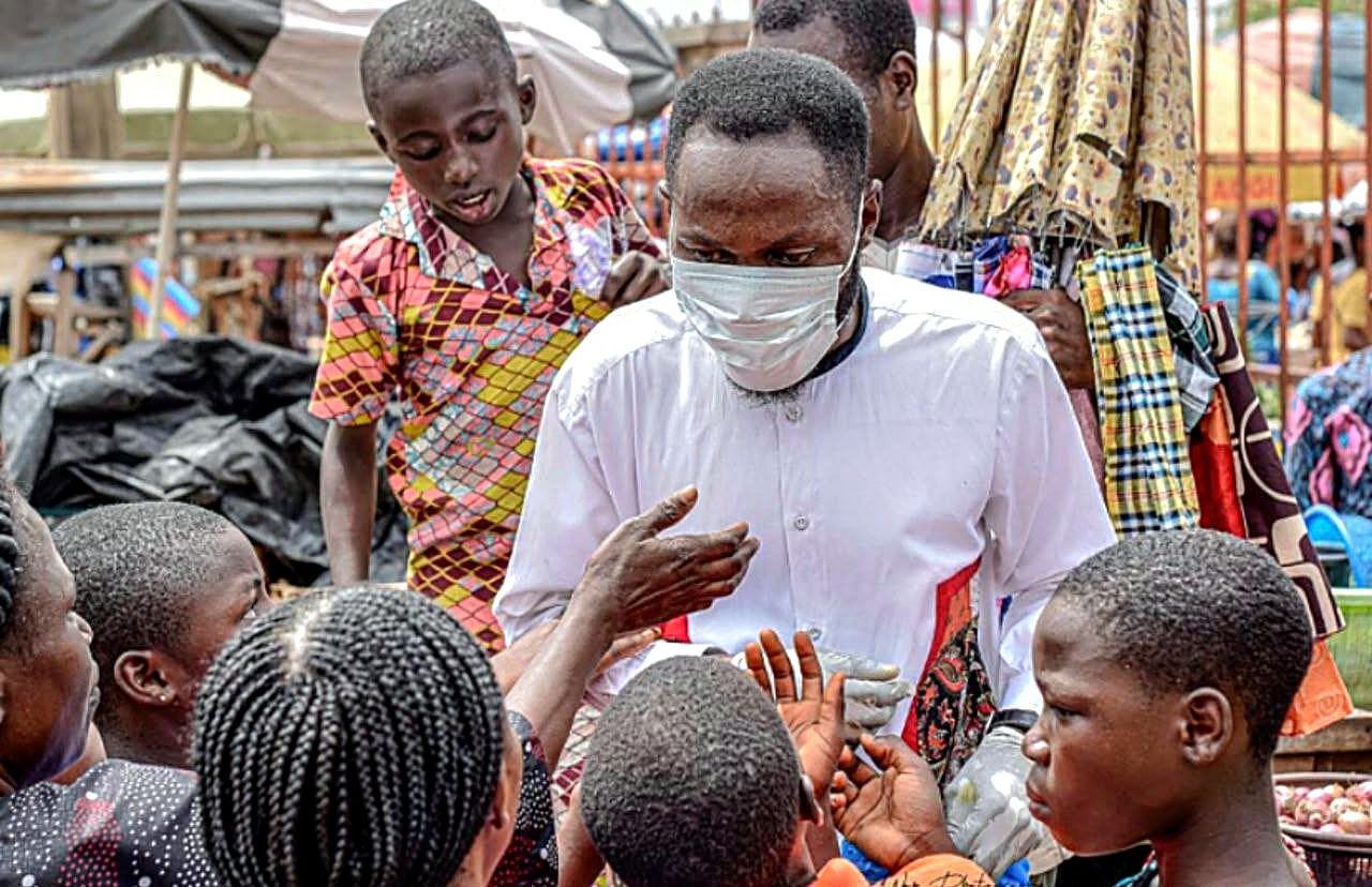 A Susi Helping Hands Foundation volunteer engaging with children during a community outreach in Nigeria