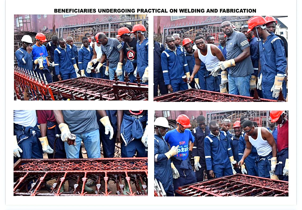 Instructor demonstrating fabrication techniques on a metal gate